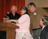 install_46.jpg - Jack Walts giving Cyndy and Charles a gift.